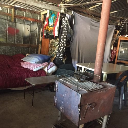 Bed and heater in shed